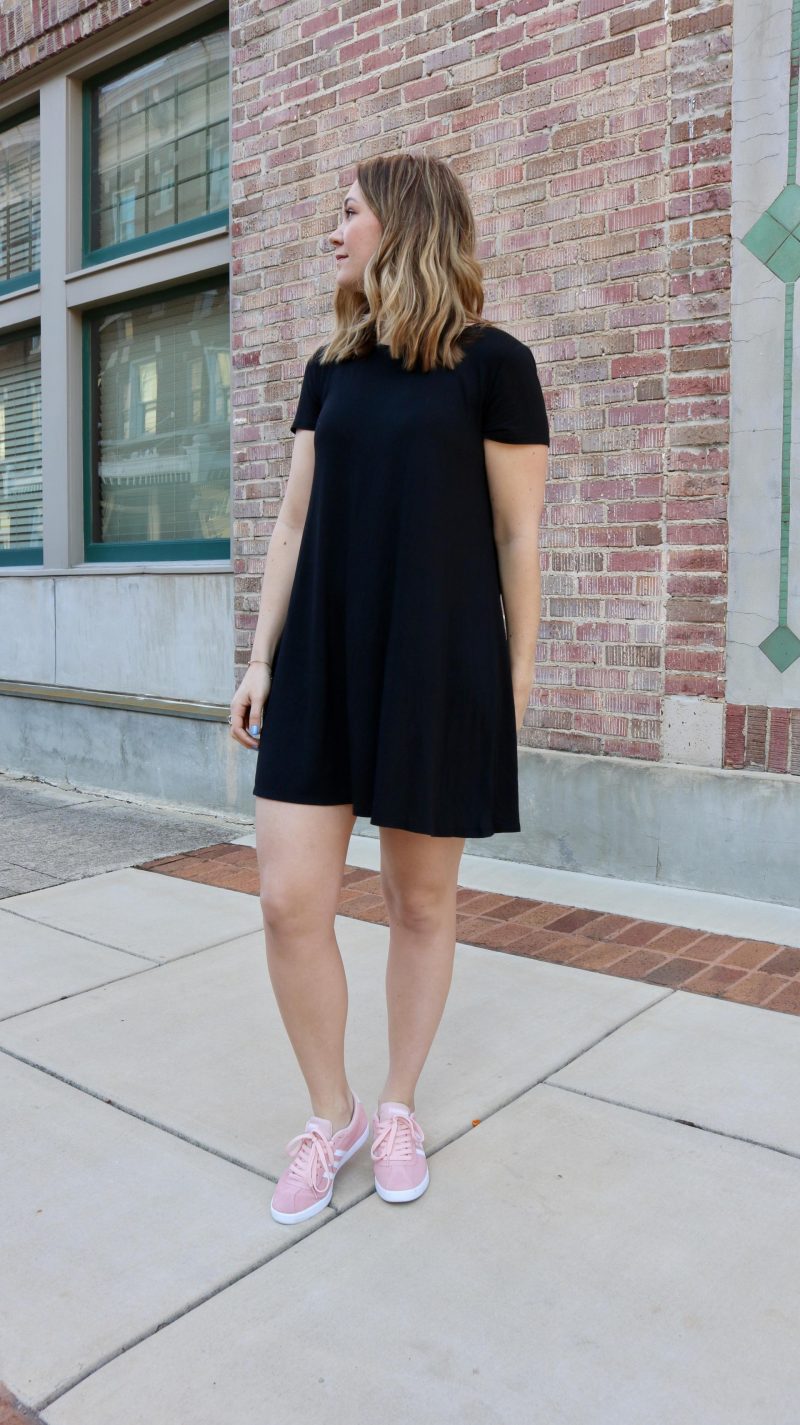 black dress and pink shoes